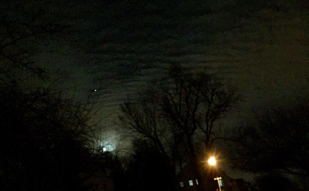 altocumlus undulatus clouds with moon
